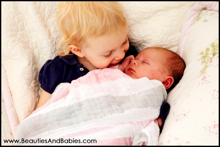 child holding newborn baby sibling Los Angeles photography